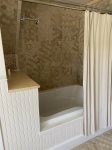 Shared full bathroom with tub shower combo